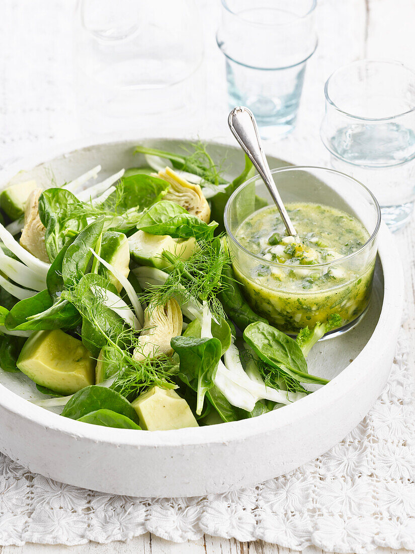Avocado,spinach and artichoke salad with green sauce