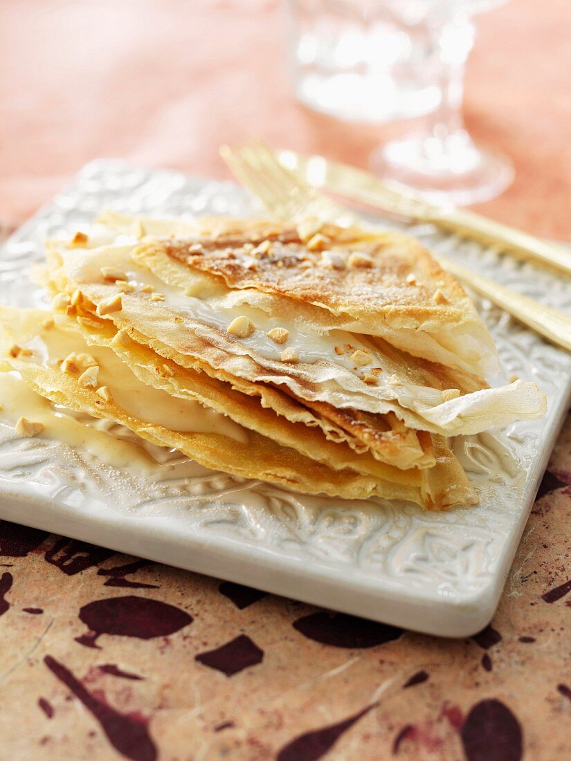 Pastilla with milk sauce and almonds