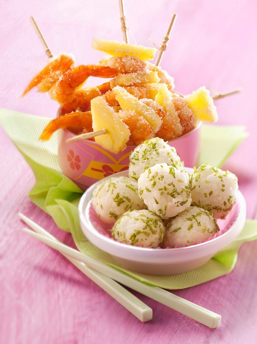 Shrimp and pineapple brochettes coated in coconut,lime-flavored rice balls