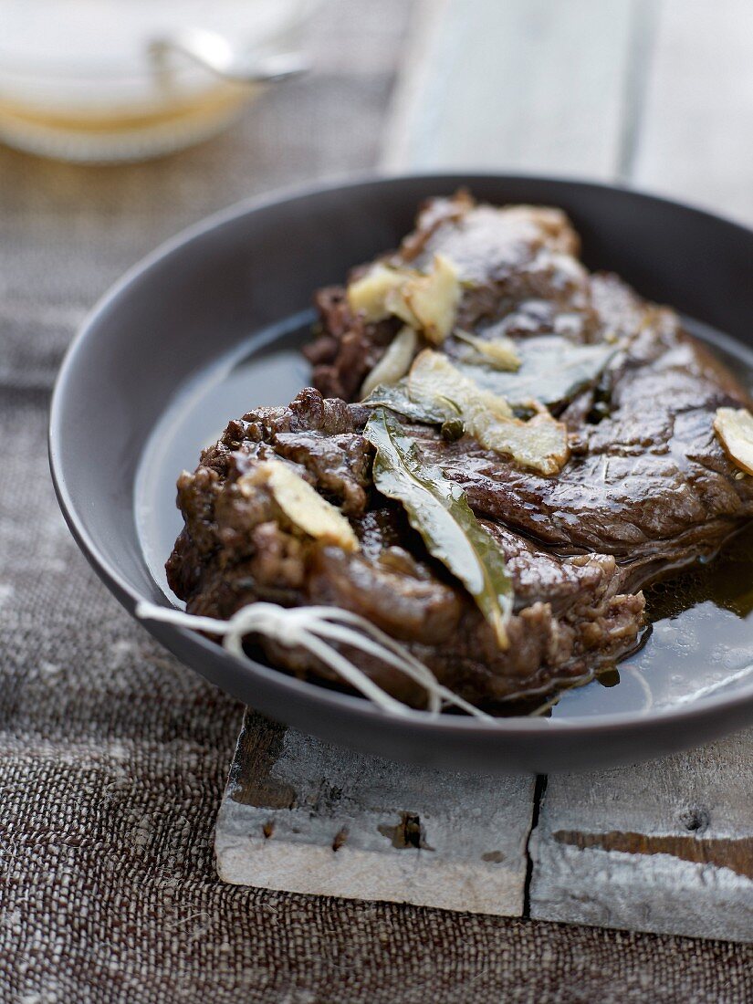 Beef chop poached in ginger broth