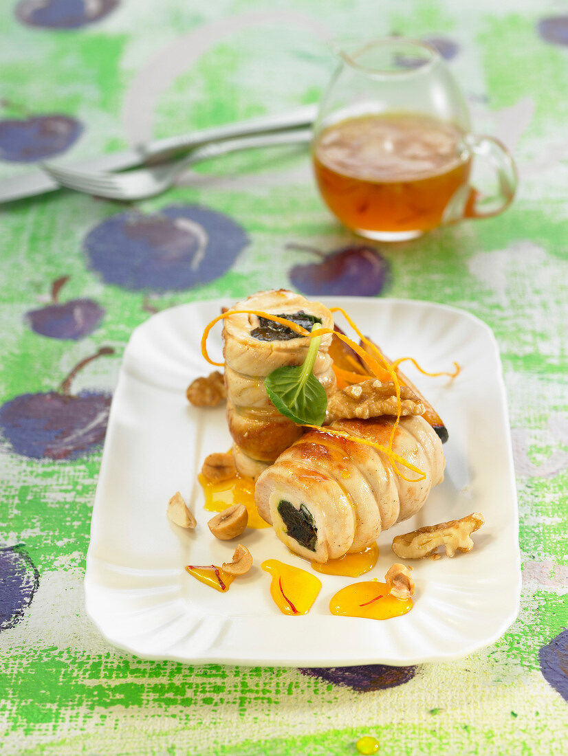 Rolled chicken breasts stuffed with prunes and oranges