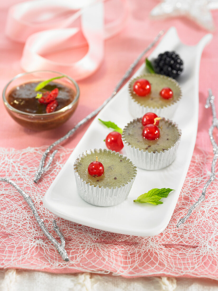 Kiwi jelly with redcurrants, prune sauce