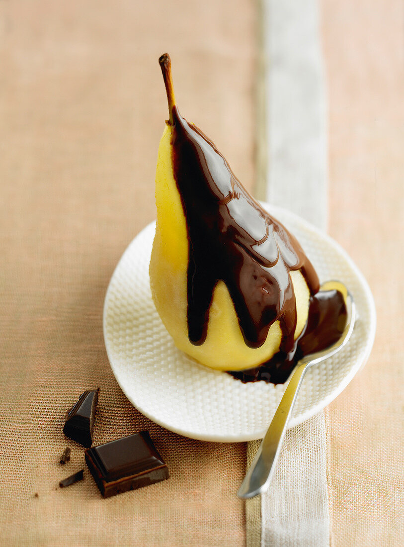 Poached pear with chocolate sauce