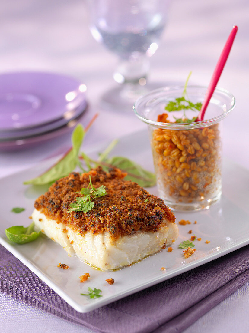 Thick piece of fish coated with red pesto, bulghour Verrine