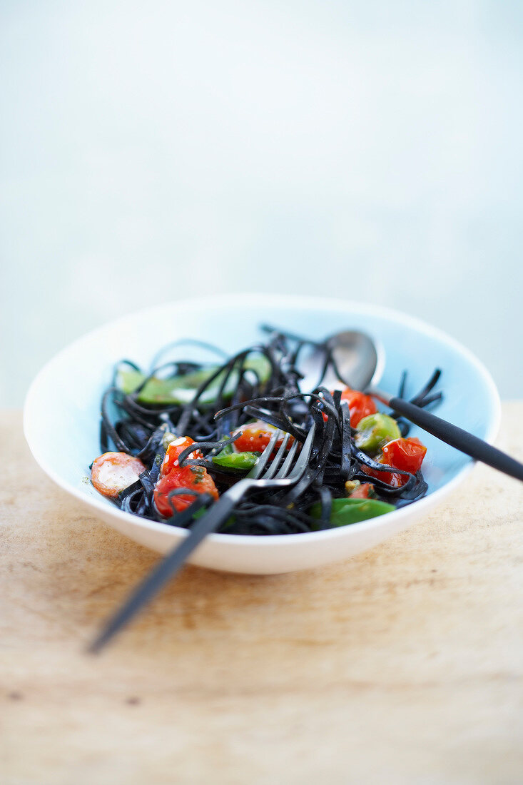 Black pasta with vegetables