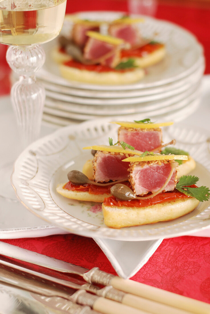 Tuna Crostinis with capers and cilantro