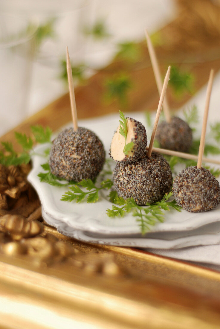 Foie gras balls coated with poppyseeds