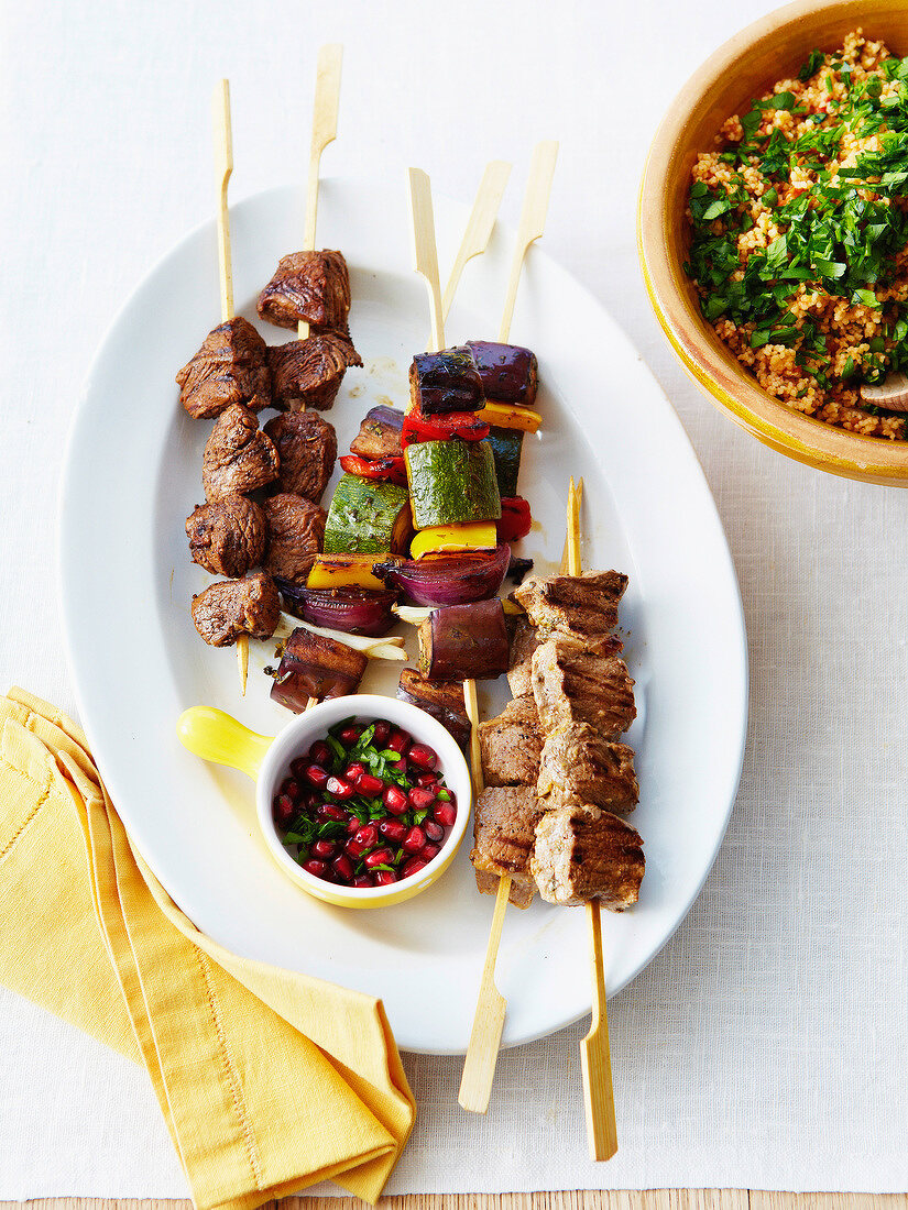 Beef and vegetable brochettes ,pomegranate sauce,bulghur with herbs