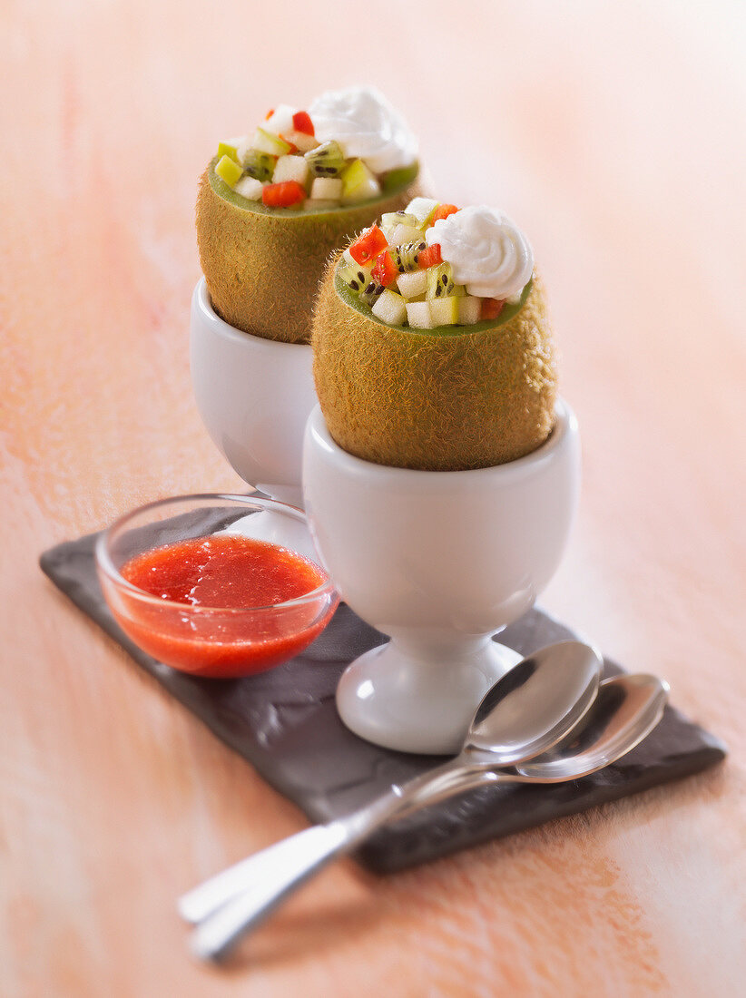 Kiwis filled with strawberries and apple