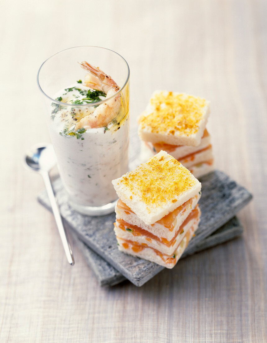 Tzatziki with shrimps, salmon and turmeric mini club sandwiches