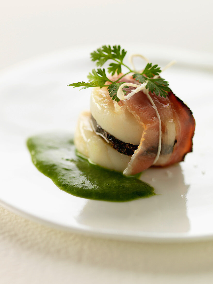 Scallop, truffle and streaky bacon appetizer with chervil sauce