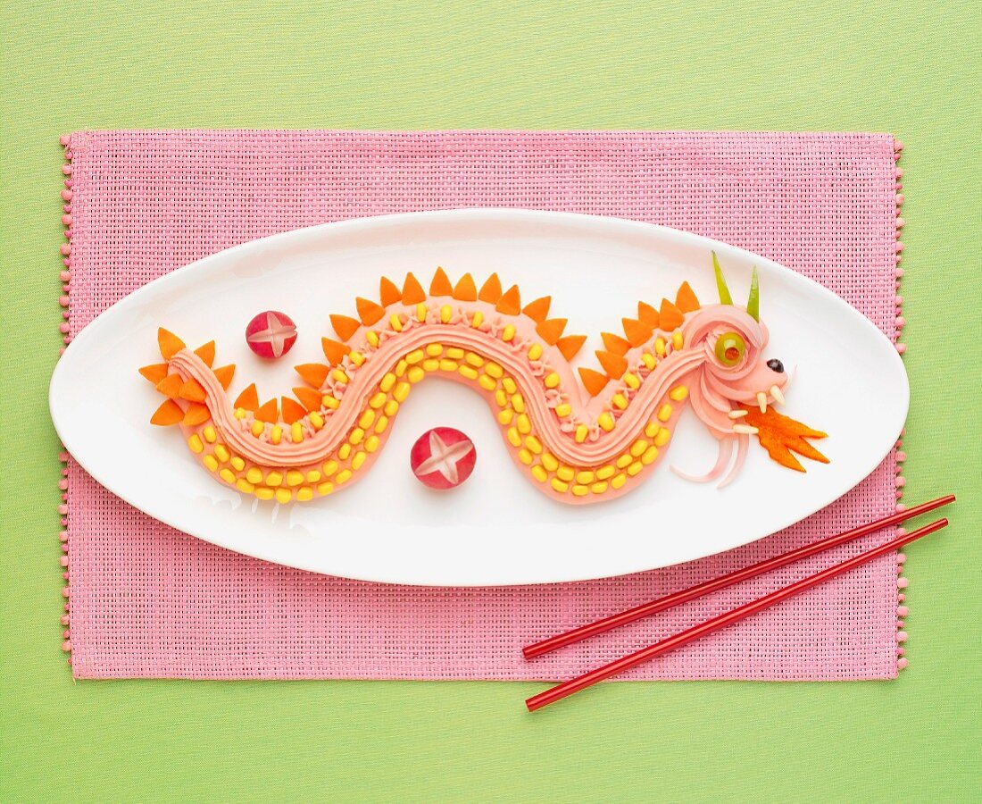 Chinese dragon made out of tarama,carrots and sweet corn