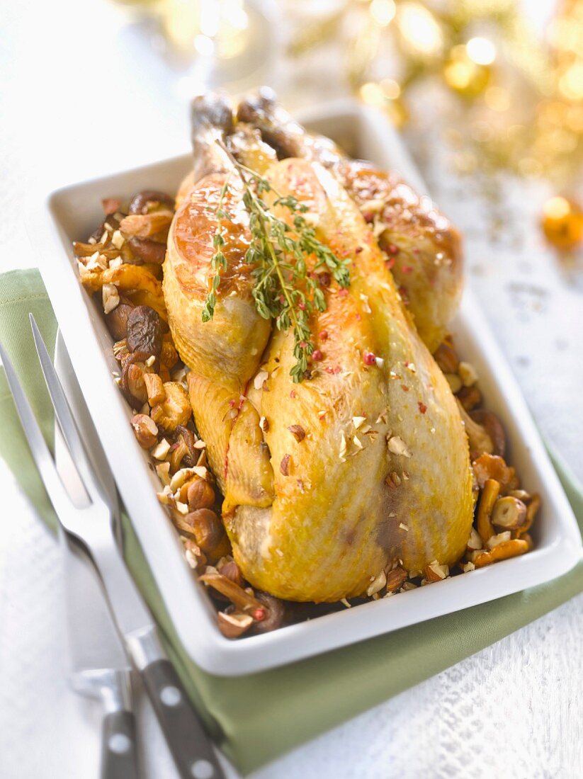 Stuffed guinea-fowl with wild mushrooms and hazelnuts