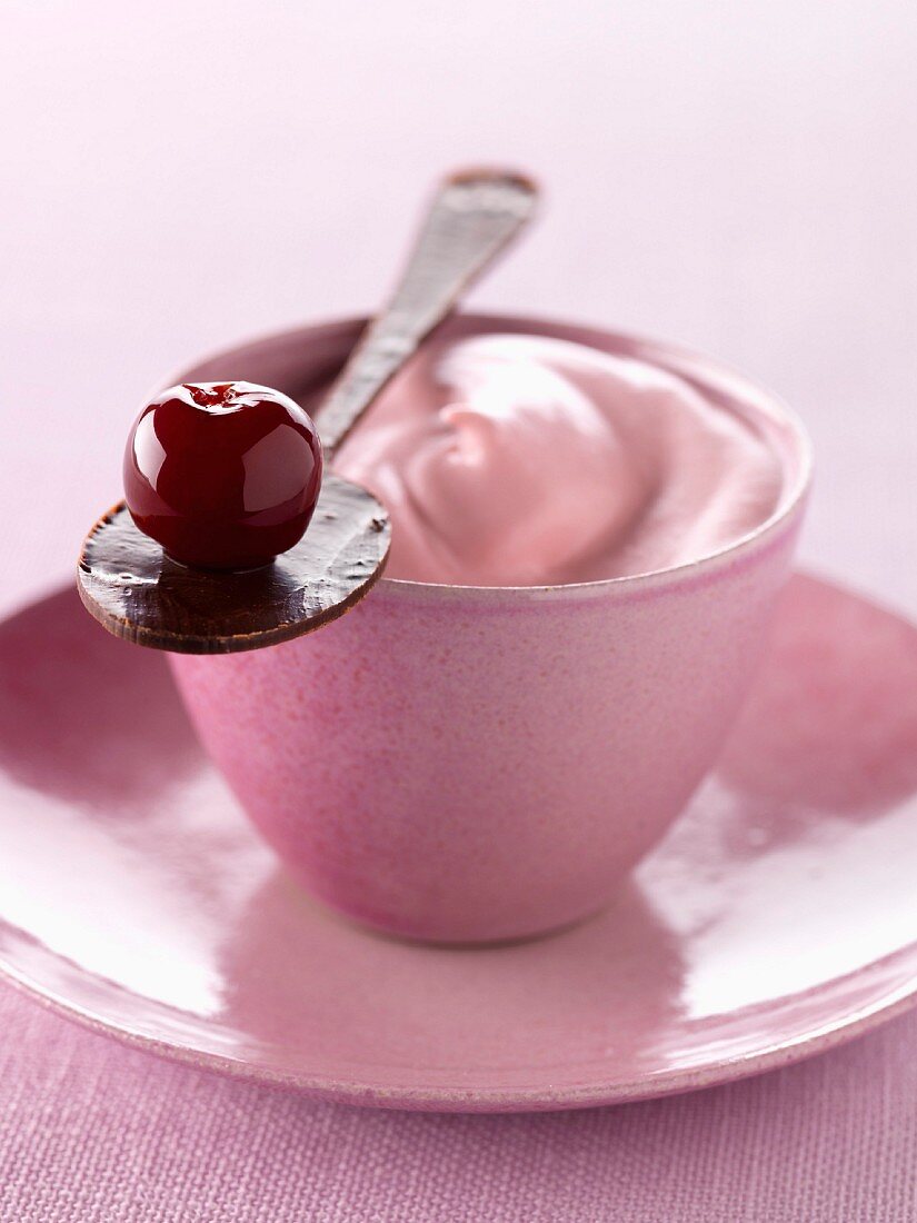 Cherry liqueur whipped cream and a spoonful of chocolate