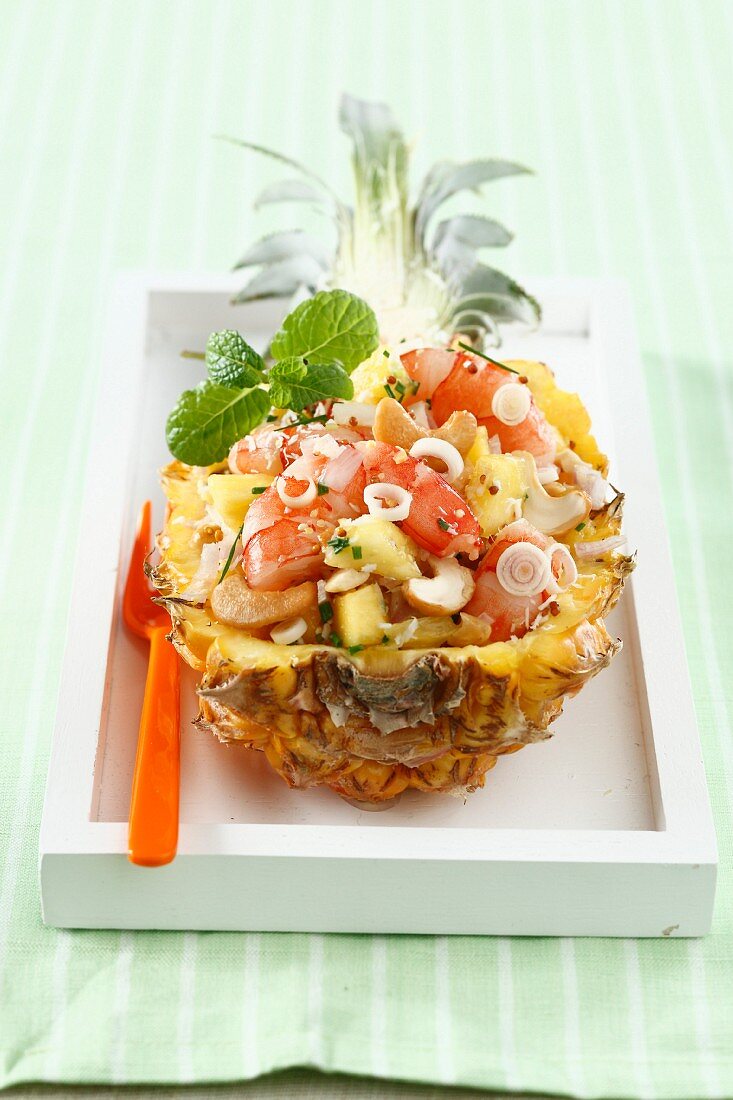 Citronella Thai salad served in half a pineapple
