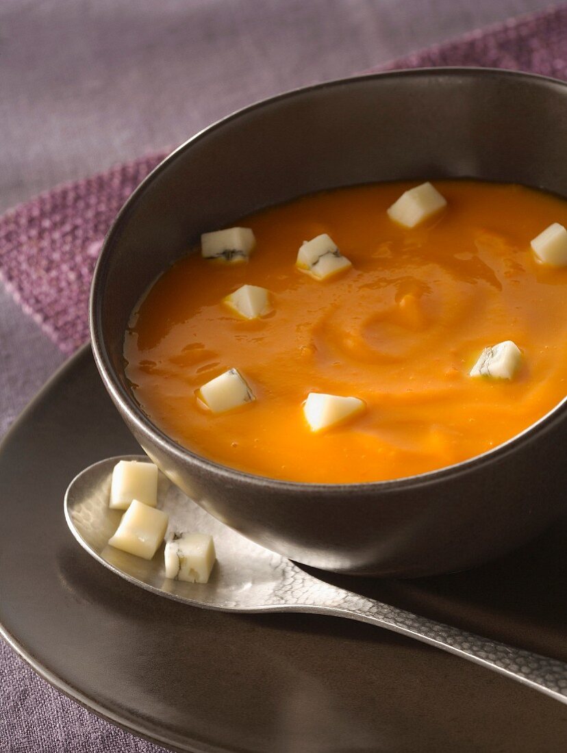 Cream of pumpkin soup with diced Morbier