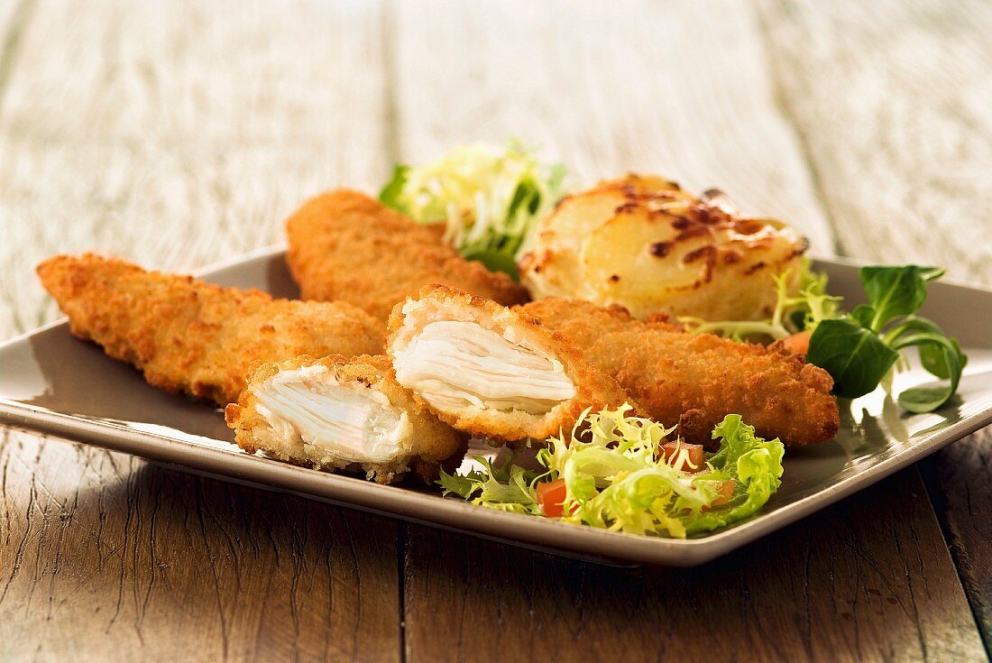 Chicken breasts coated in breadcrumbs