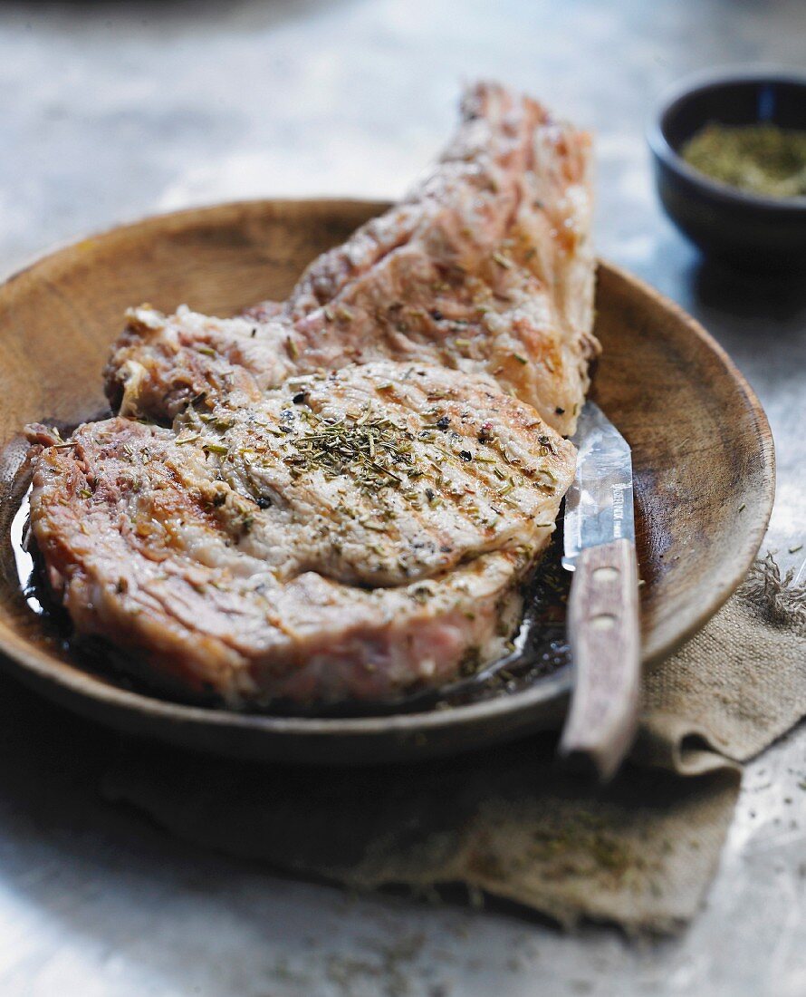 Grilled veal chop with herbs
