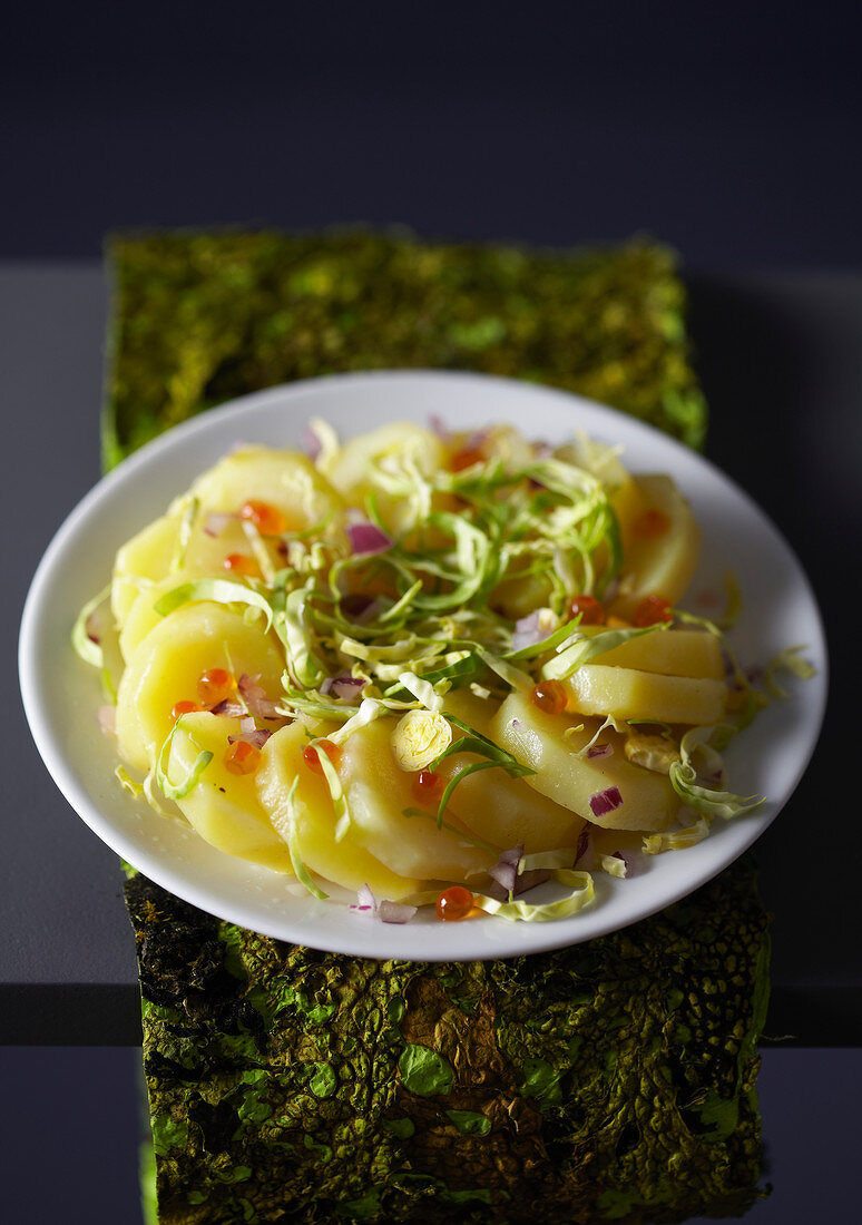 Warm potato salad with thinly sliced Brussels sprouts