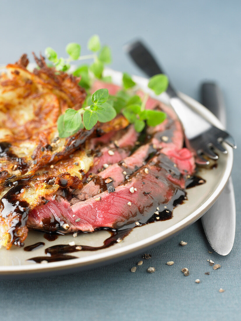 Sirloin steak with balsamic vinaigar and potato röstis