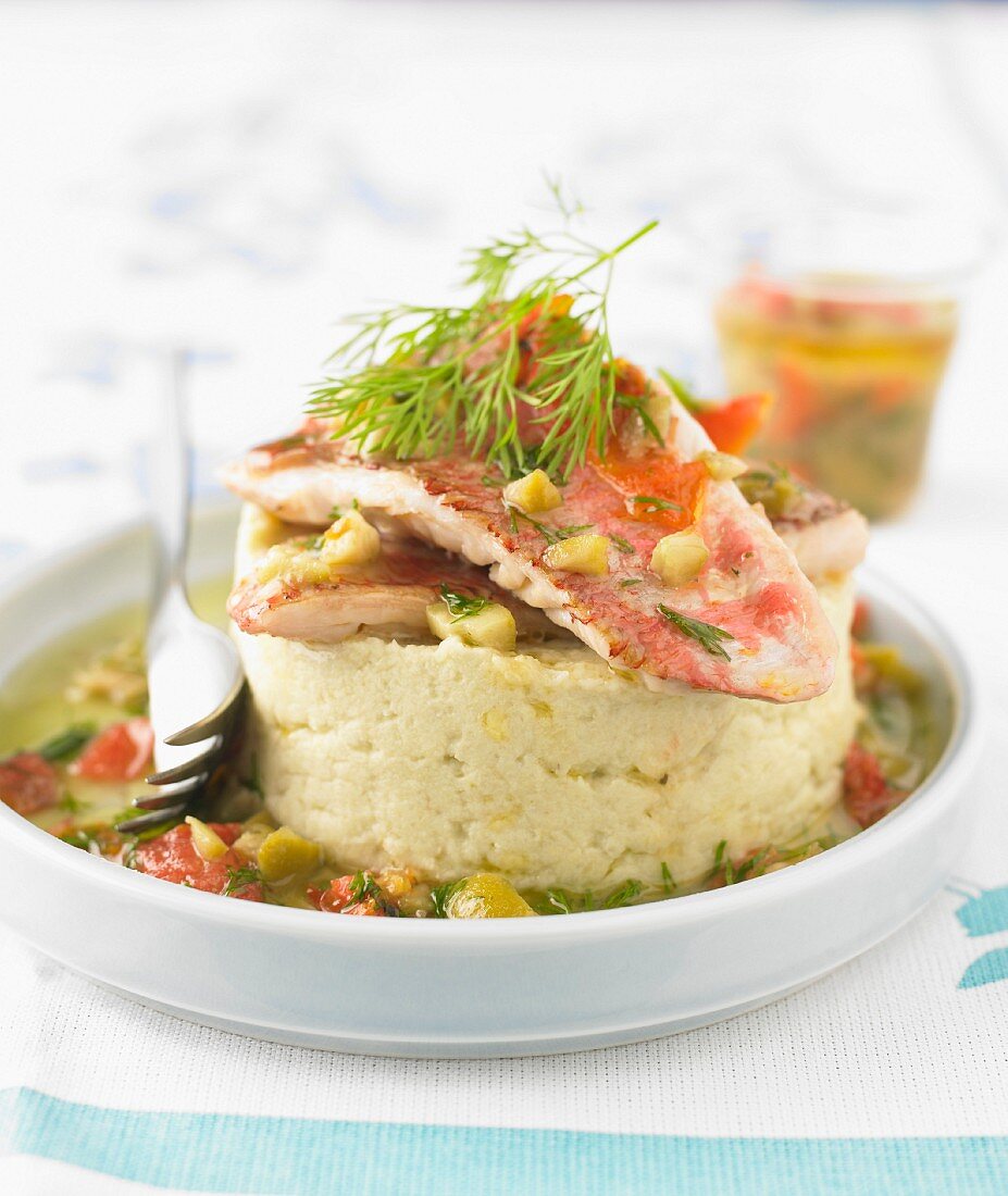 Mashed potato timbale with red mullet fillets, tomatoes and olives