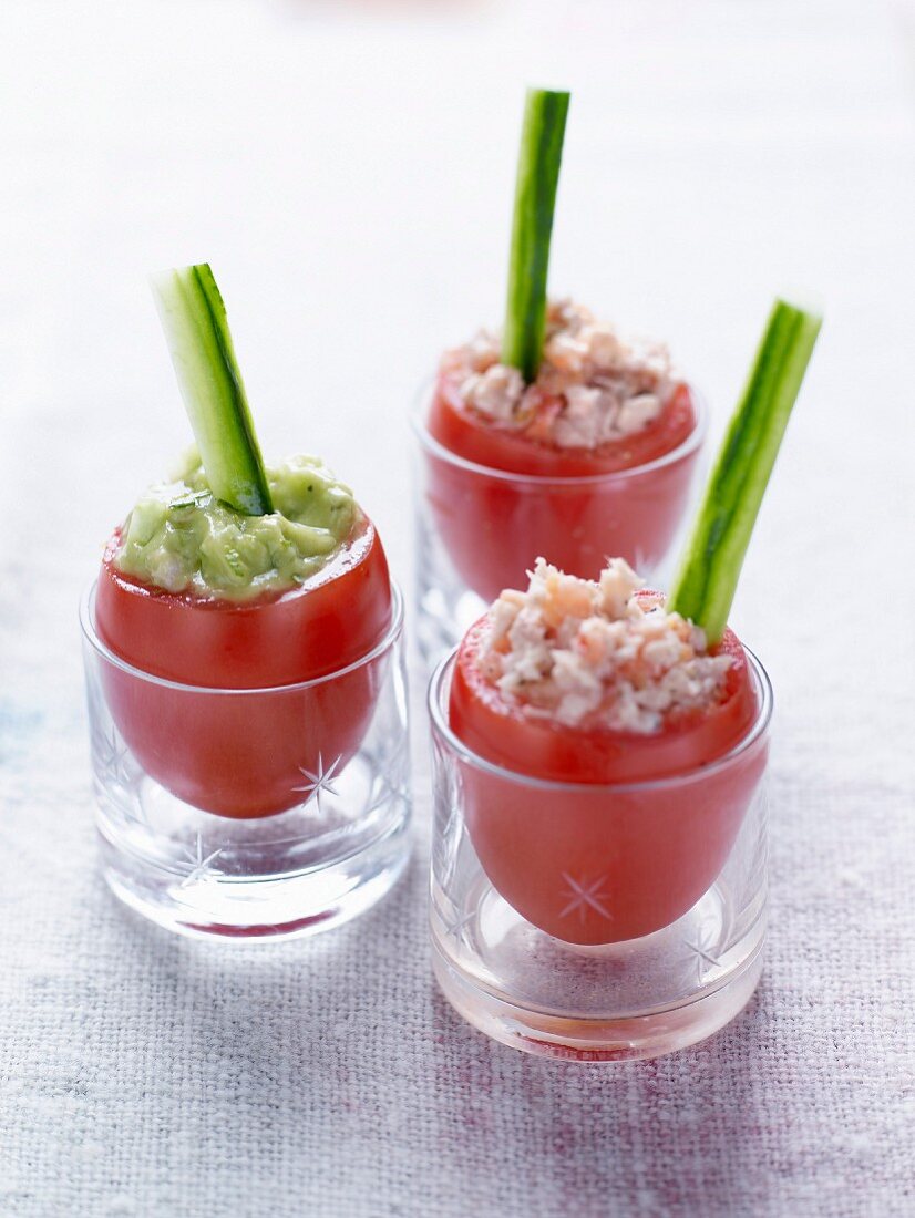 Three different flavored raw stuffed tomatoes