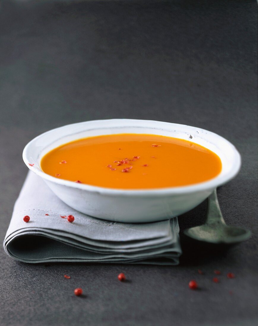 Cream of pumpkin soup with pink pepper
