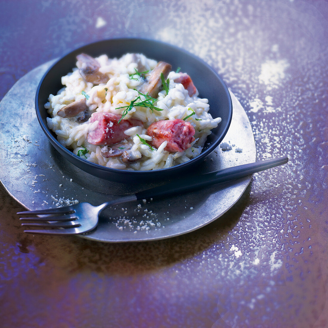 Risotto mit Merguez-Würstchen und Pilzen