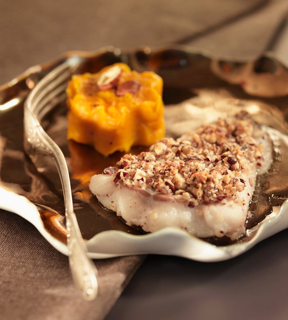 White fish fillet with a hazelnut crust and carrot puree