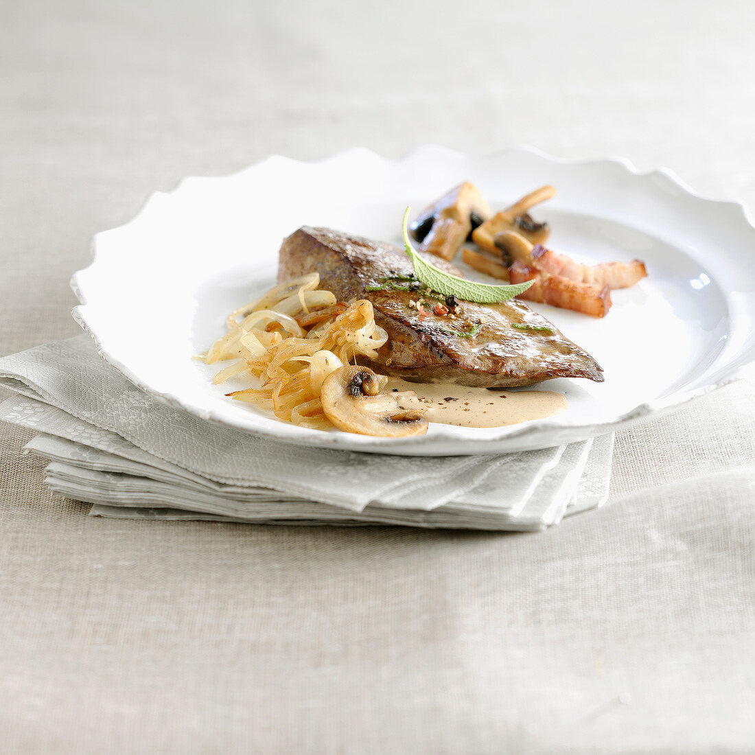 Veal liver with creamy onions and mushrooms