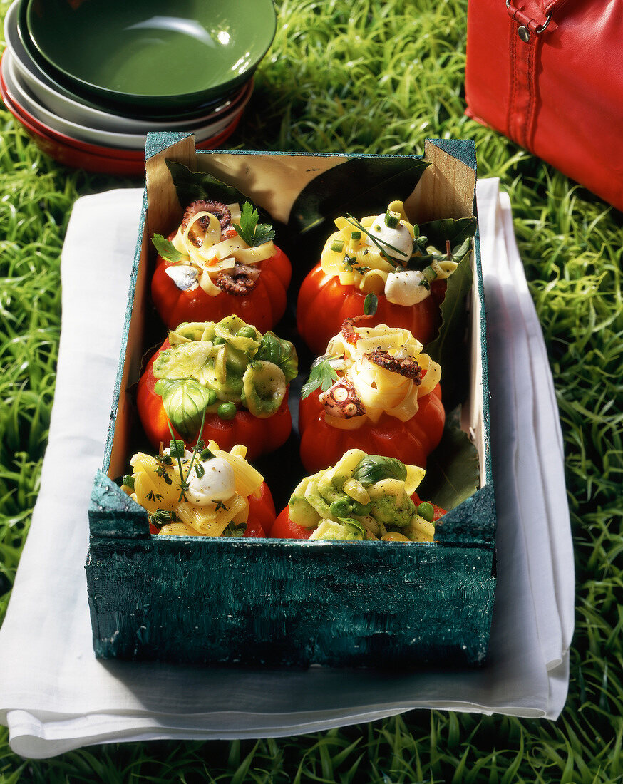 Tomatoes stuffed with pasta,octopus and pesto