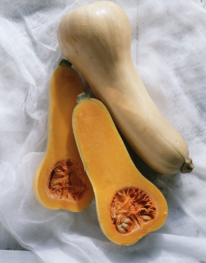 Two Butternut Squash; One Cut in Half