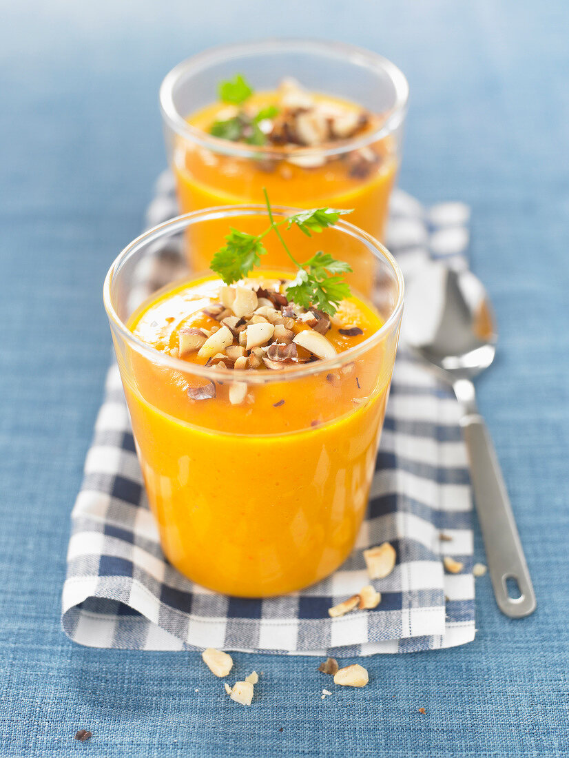 Cream of carrot soup with crushed hazelnuts