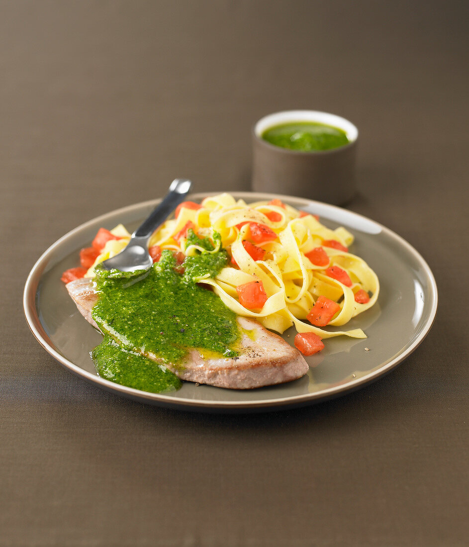 Veal escalope with pesto,tagliatelles with tomatoes