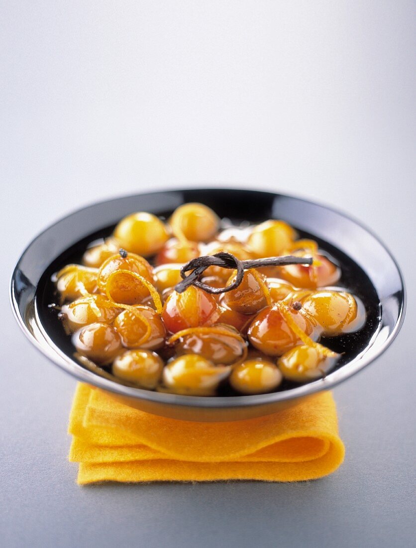 Stewed mirabelle plums with vanilla and orange zests