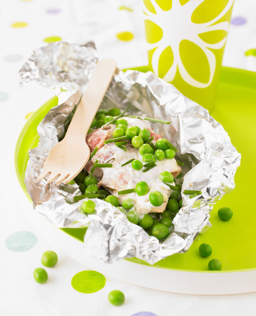 Saltimbocca ,peas and chives cooked in aluminium foil