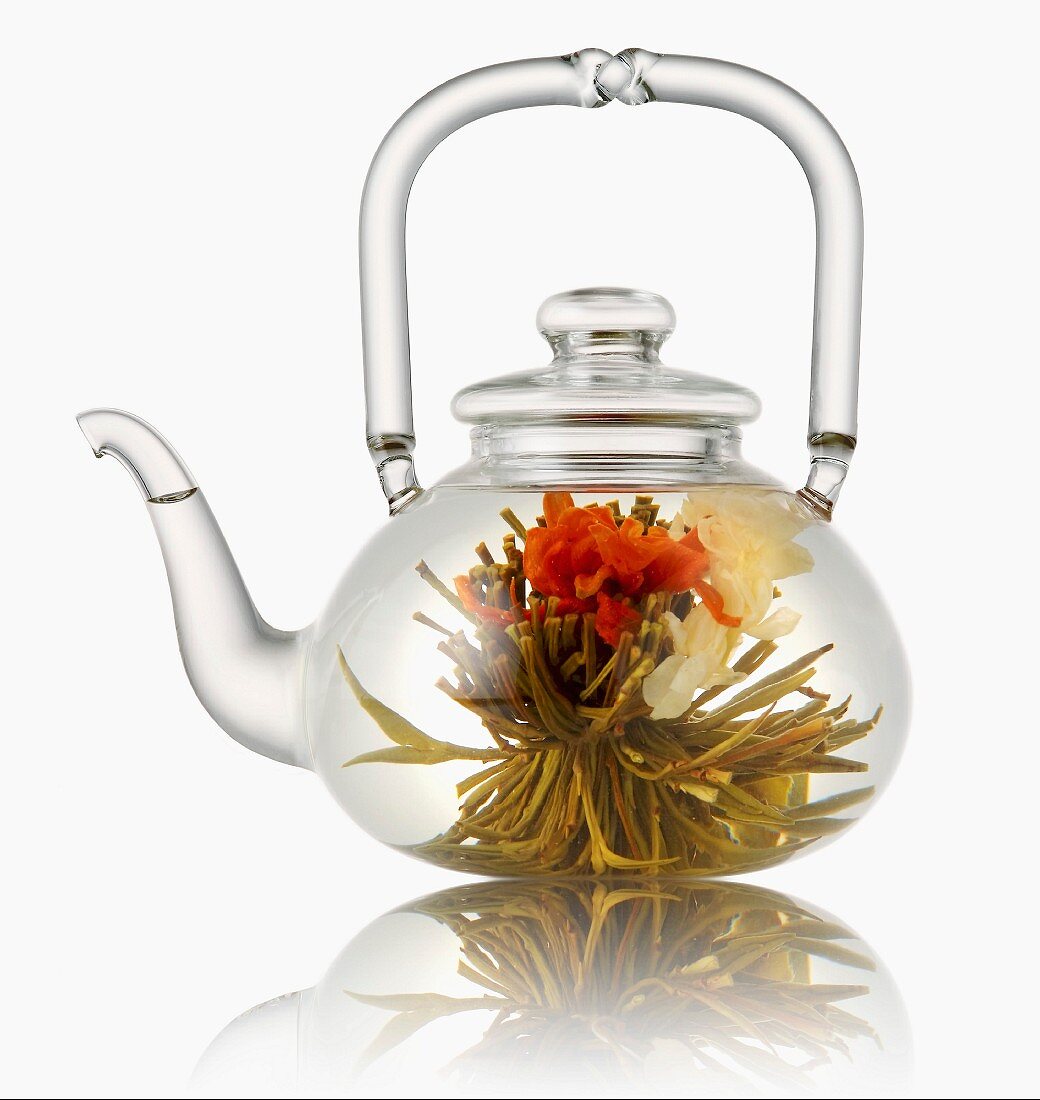 Glass teapot with tea flower