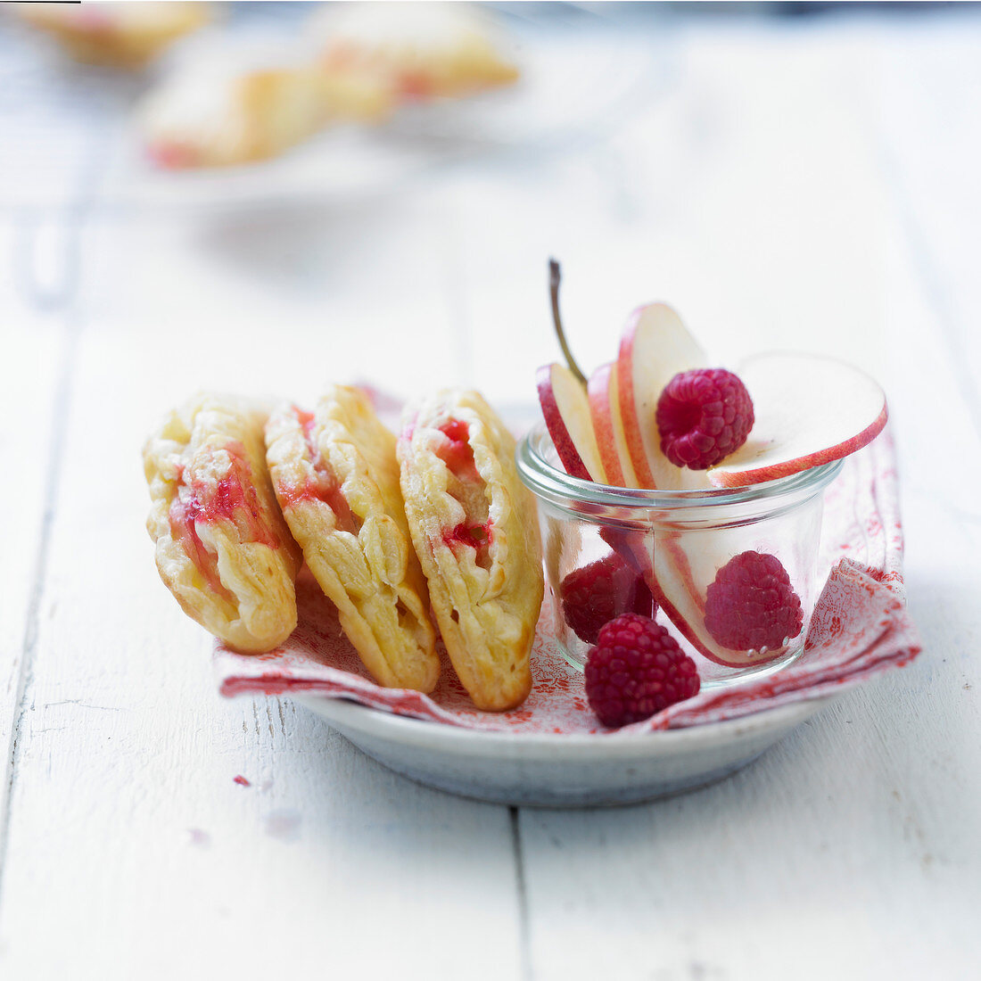 Apple-raspberry flaky pastry turnovers