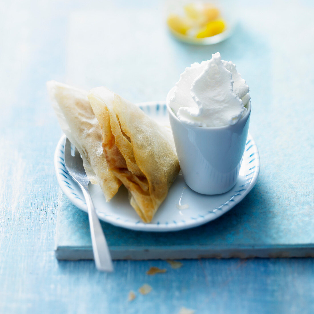 Mirabelle filo pastry turnovers with vanilla-whipped cream
