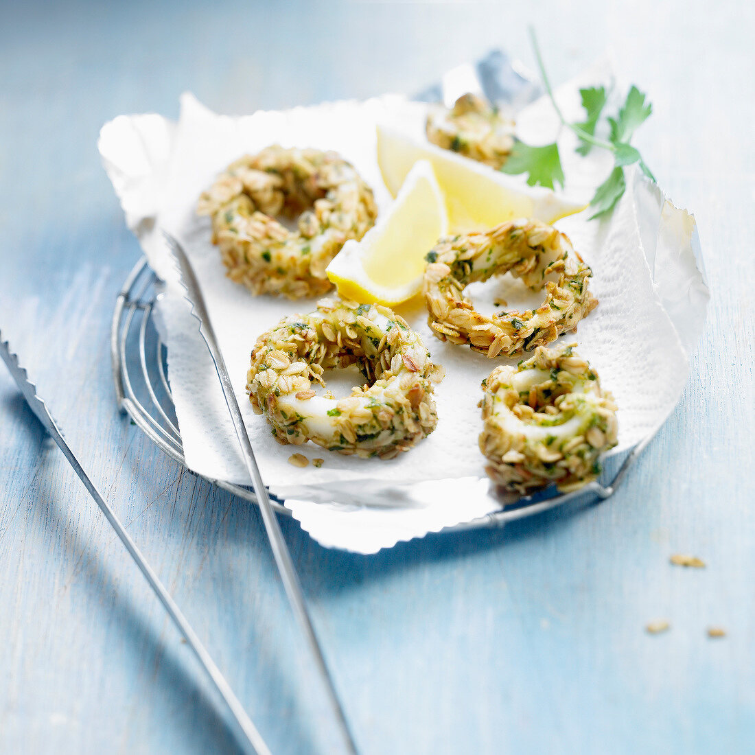 Fried squid rings coated with oatmeal and parsley