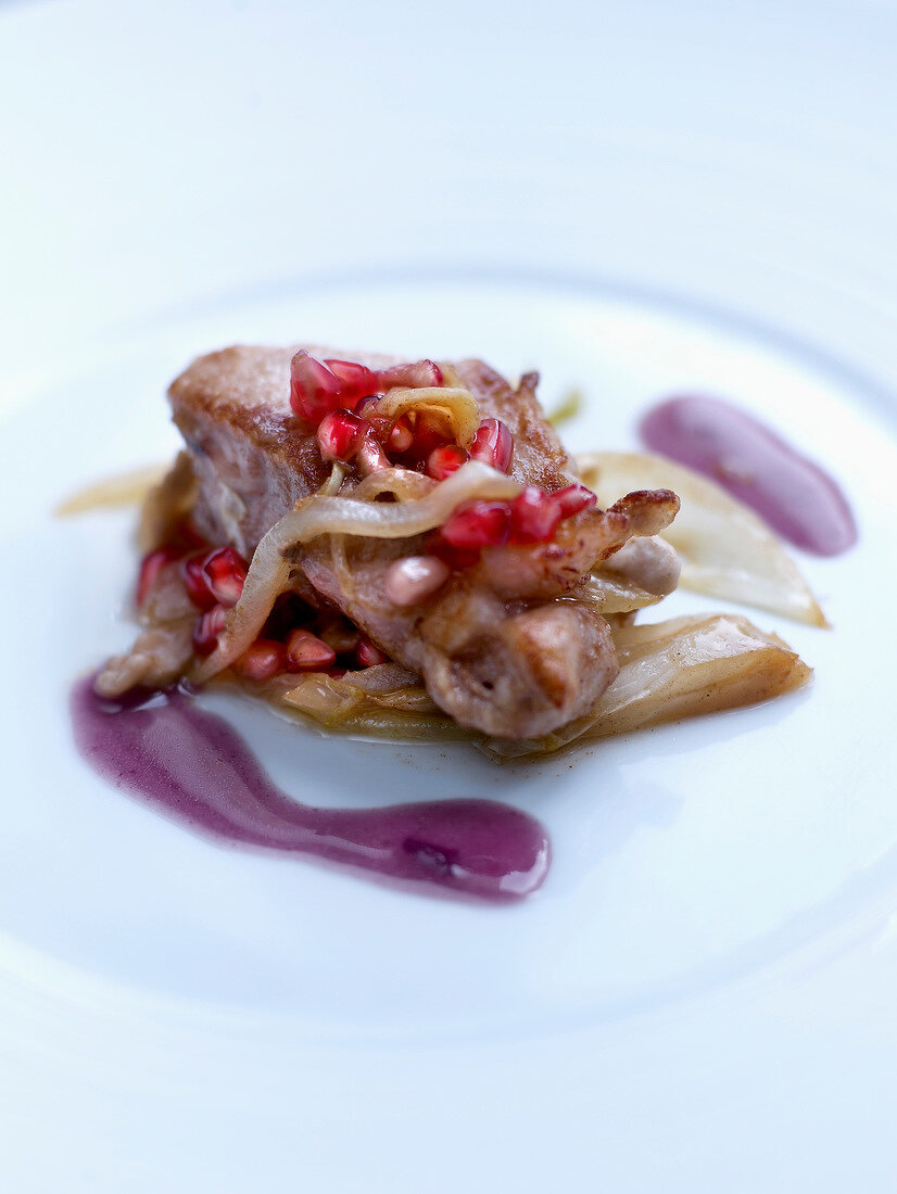 Veal with pan-fried chicory,red onion butter and pomegranate seeds