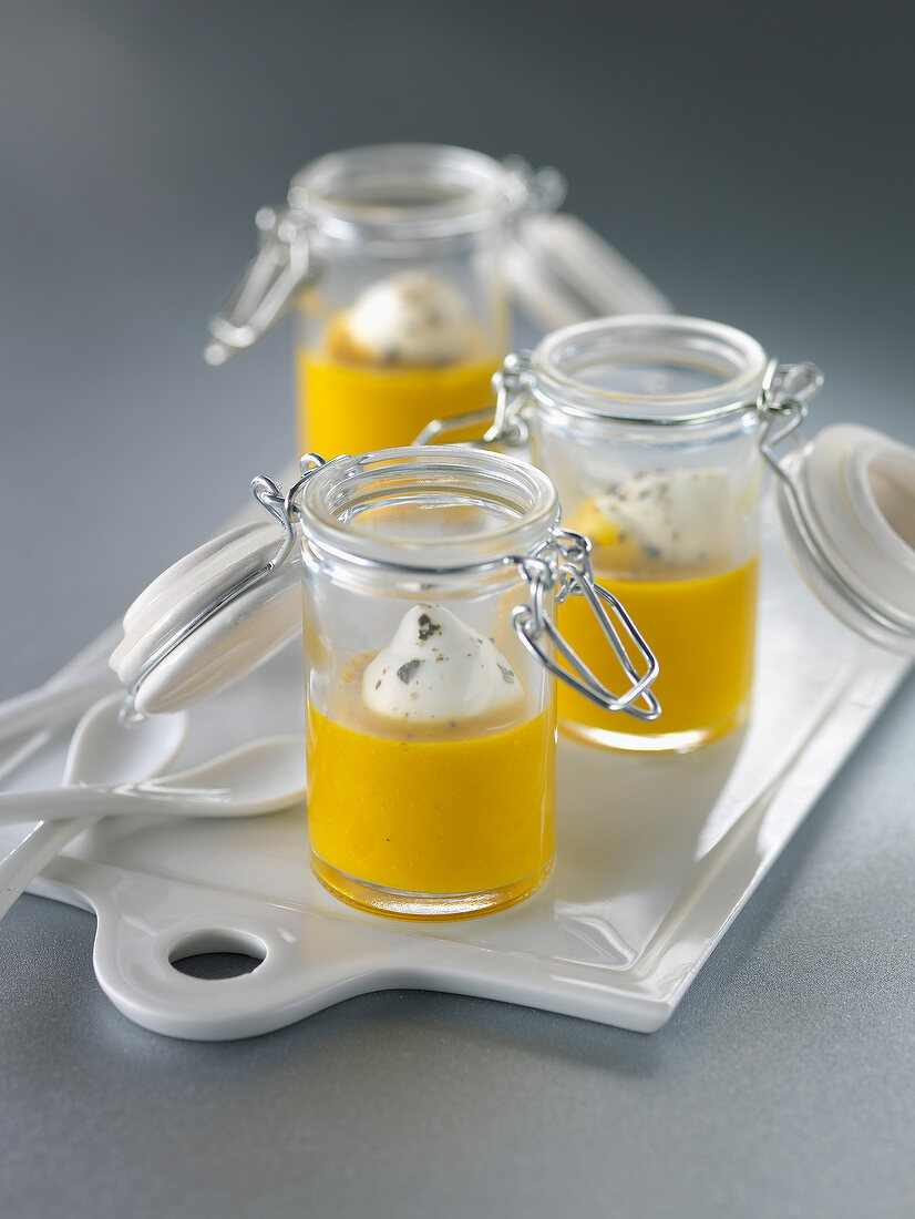 Cream of pumpkin soup served in mini glass jars