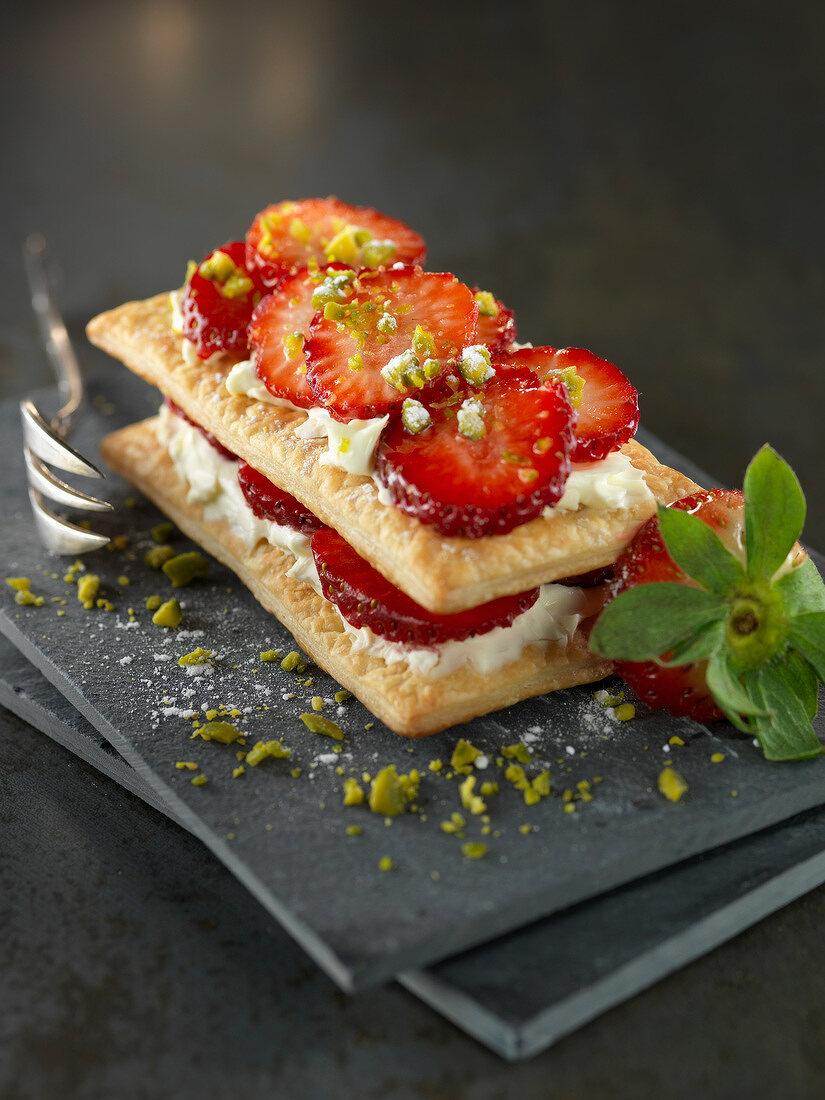 Mascarpone and strawberry puff pastry with crushed pistachios