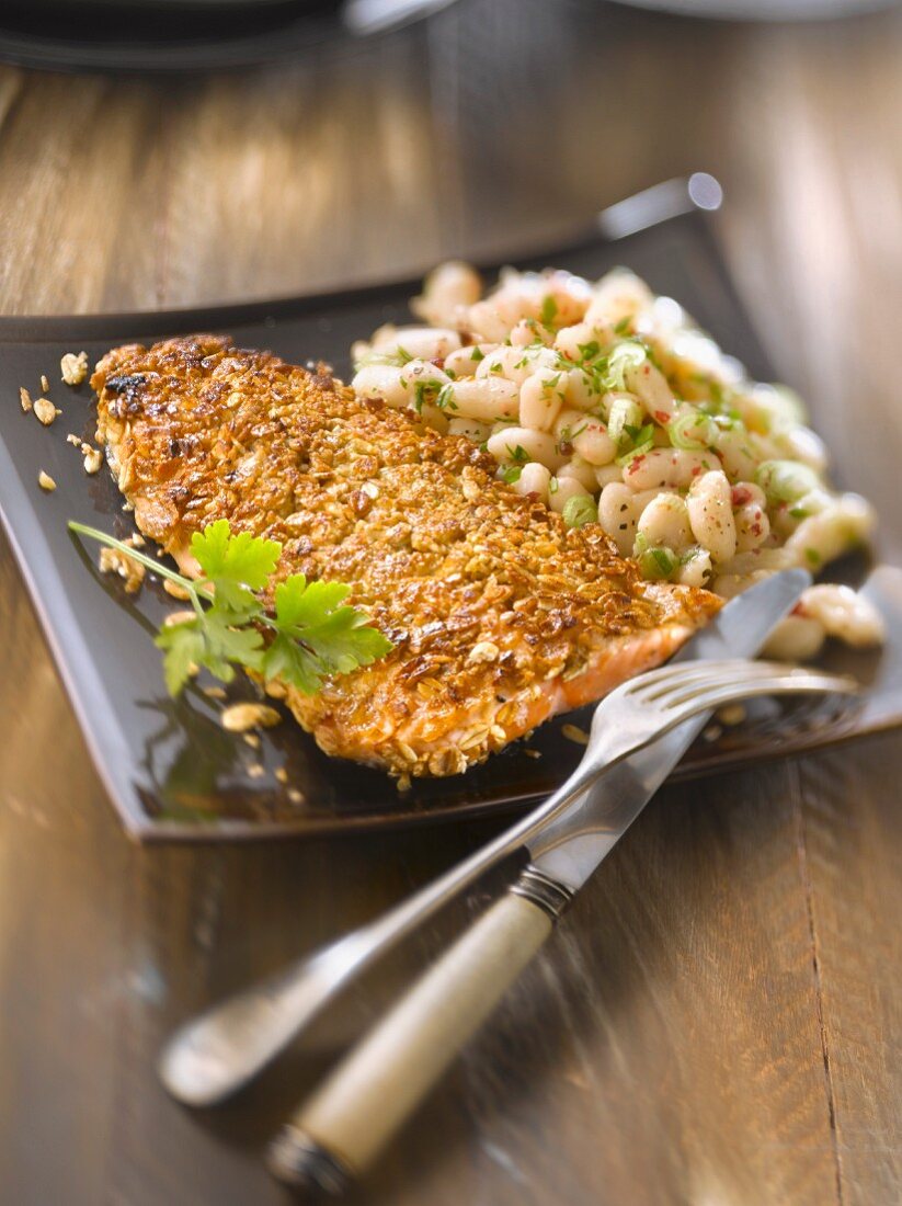Trout fillet in cereal crust, white bean salad