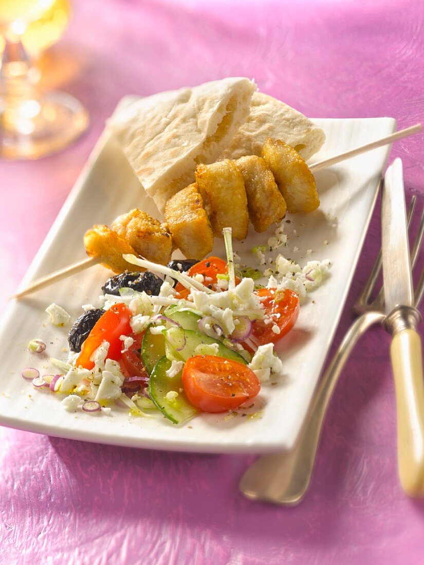 Grilled chicken brochette , Greek salad and pitta