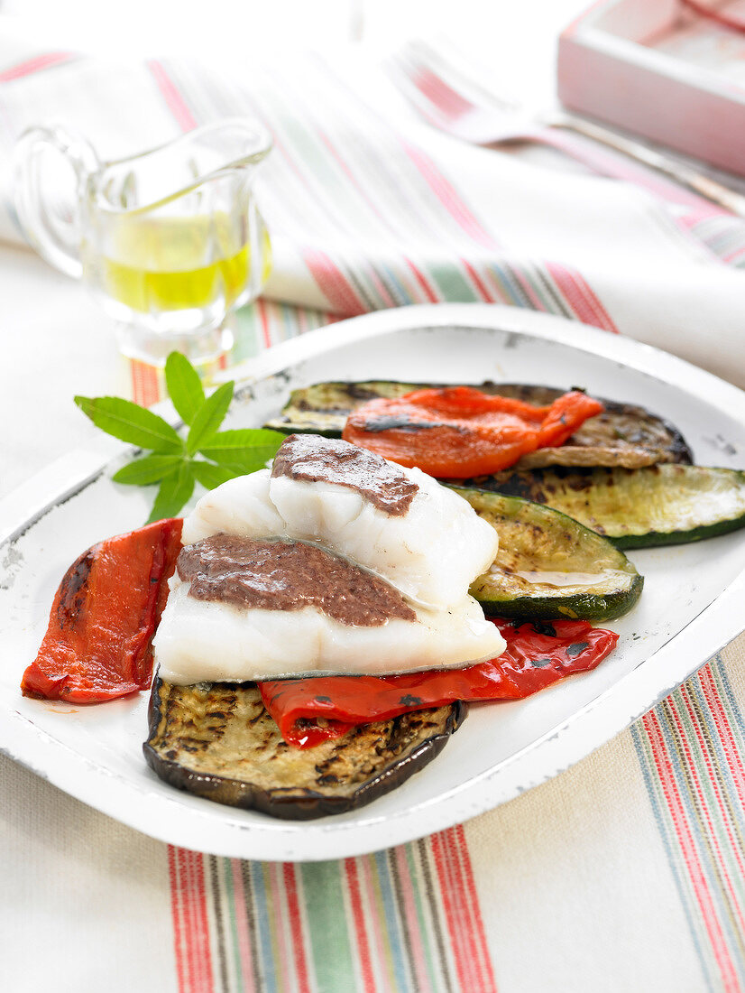 Salt cod with tapenade, grilled eggplants and red peppers