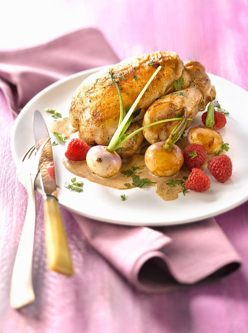 Roast young cockerel with raspberries and spring turnips