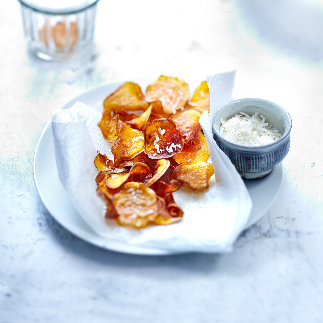 Sweet potato crisps sprinkled with grated coconut