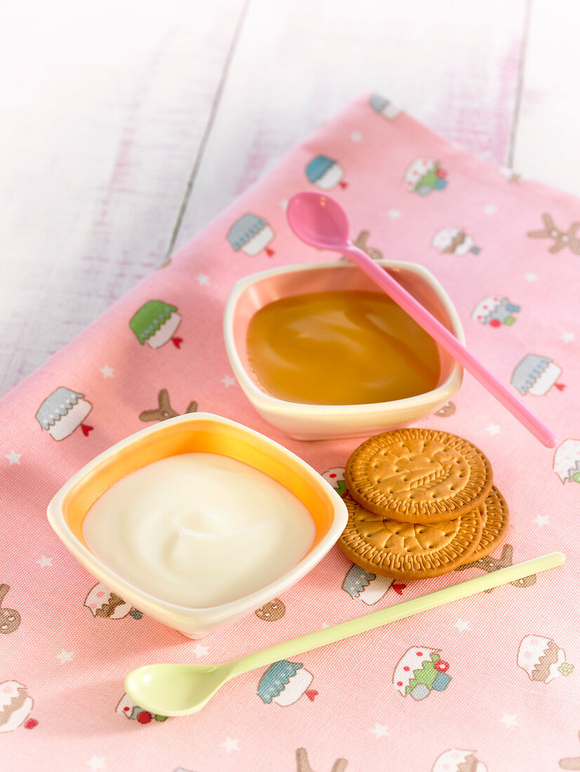 Yoghurt, and fruit compote and shortbread cookies for a kid's breakfast