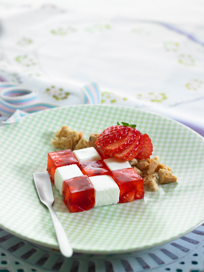 Checkered strawberry jelly cubes and white marshmallow cubes